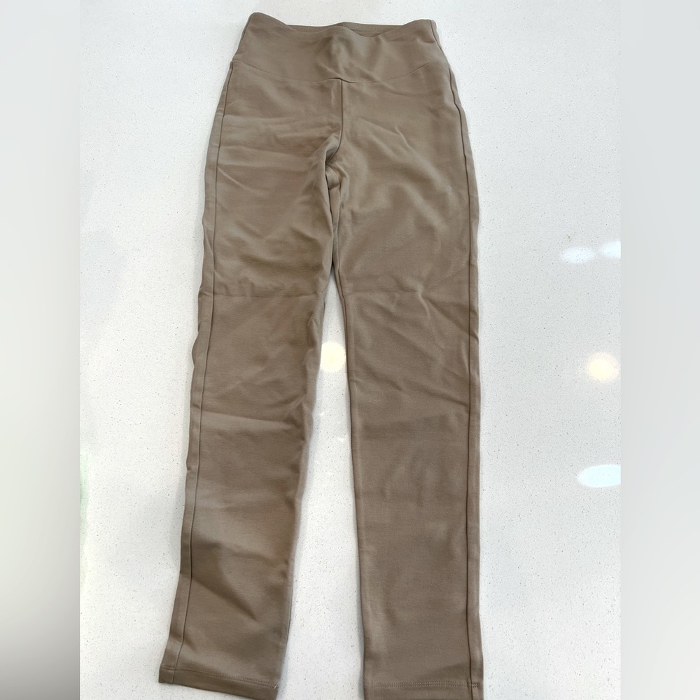Tan pointe pants.
